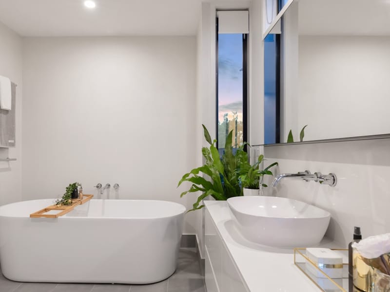 Newly installed luxury family bathroom with a freestanding bath and basin in Upminster
