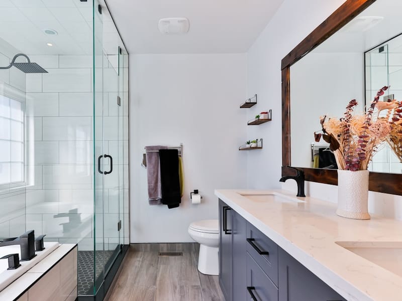 Accessible walk-in wet room with a glass shower enclosure in Collier Row