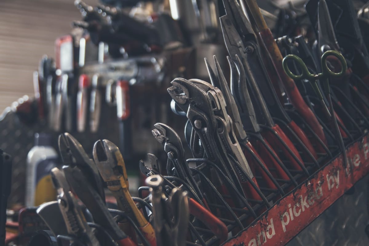 A heating engineer’s well-kept tools laid out ready for the job
